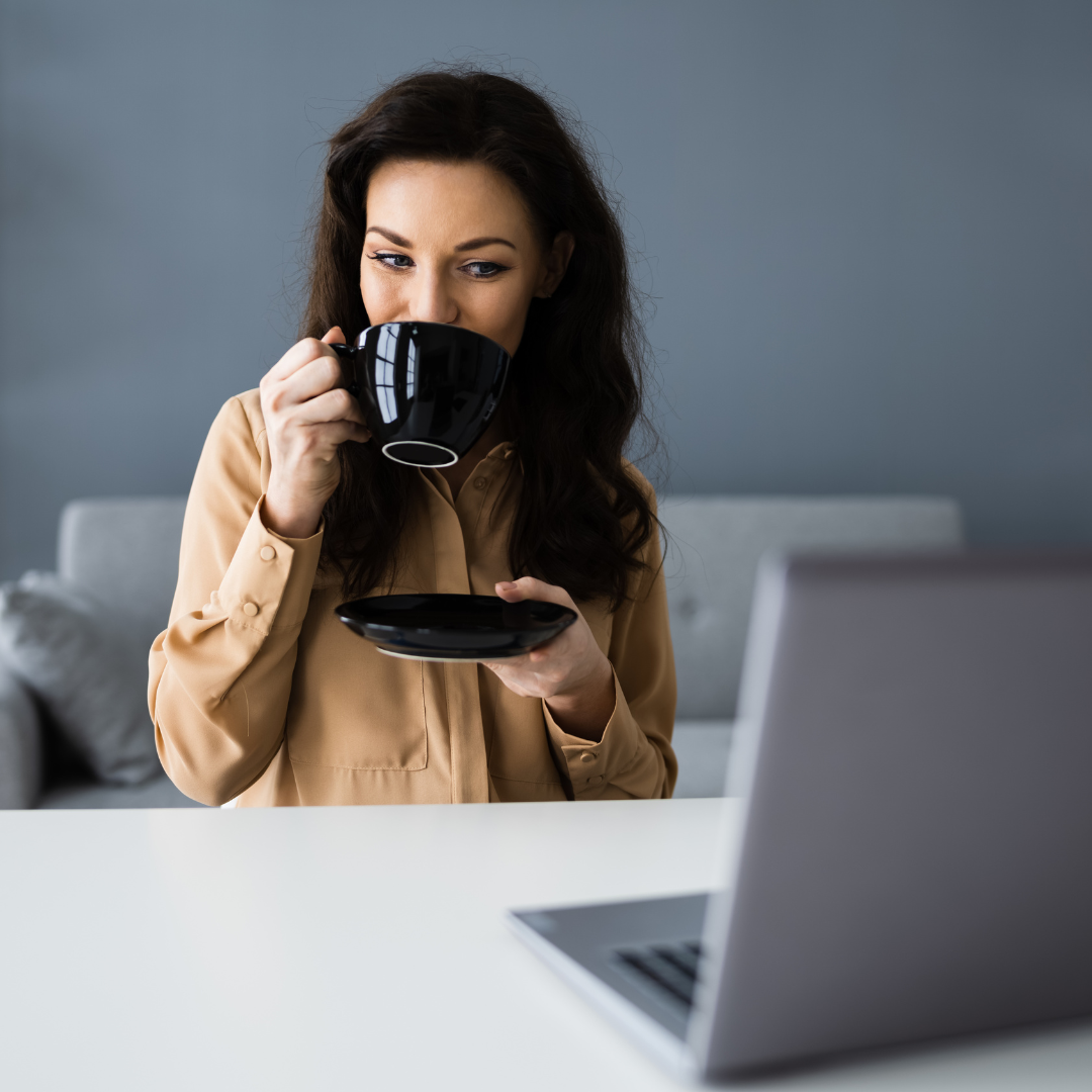 Woman drinking coffee at a virtual Behavior Therapist meetup
